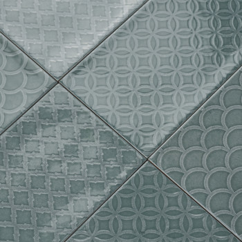 A collection of green tiles displays geometric patterns, including circles, diamonds, and scallops, creating a textured, decorat