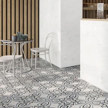 A cafe scene features a patterned tile floor with swirling black and white designs. White chairs and a table sit near a wooden s