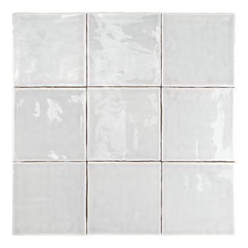 A smooth, glossy, white ceramic tile lies flat, reflecting light subtly, surrounded by a uniform white backdrop.