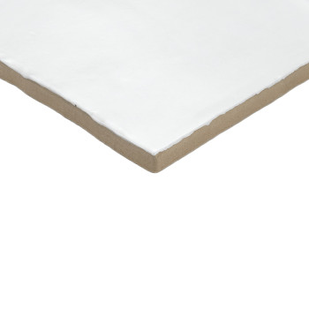 A white, square ceramic tile with smooth edges rests on a plain, light brown background, showcasing its clean, minimalist design