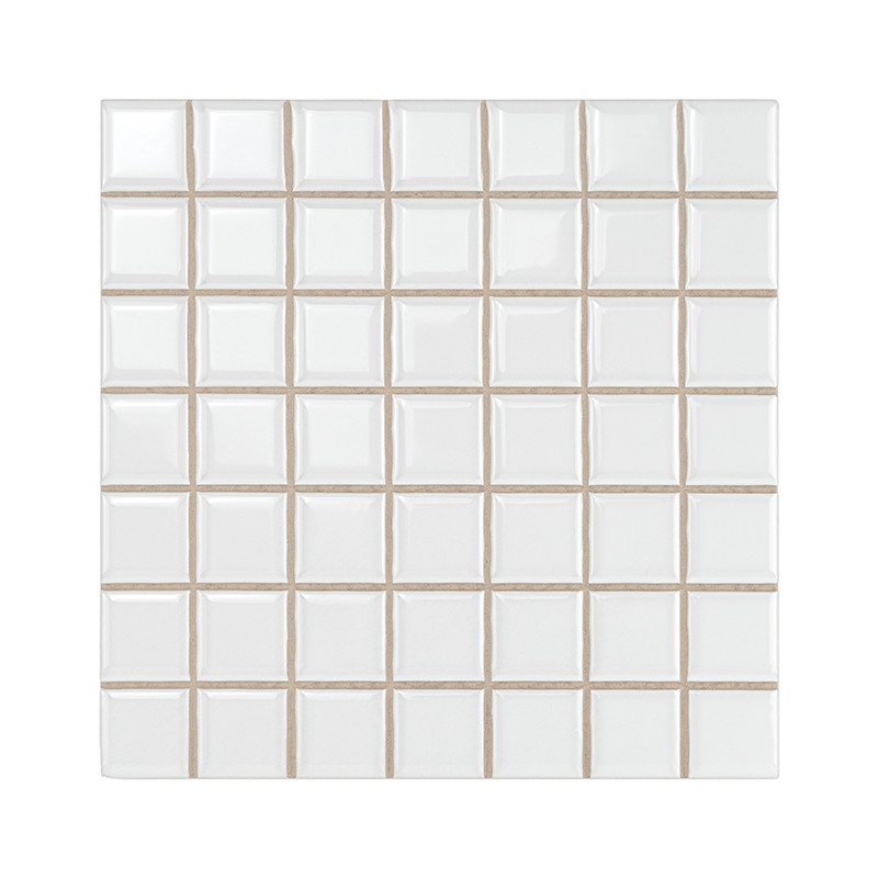 White ceramic tiles form a grid pattern, each tile slightly raised, creating a textured surface. The background is plain and min