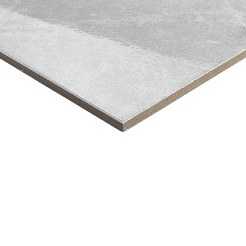 A flat, rectangular tile rests on a white background, featuring a muted gray marbled pattern that adds a subtle texture.