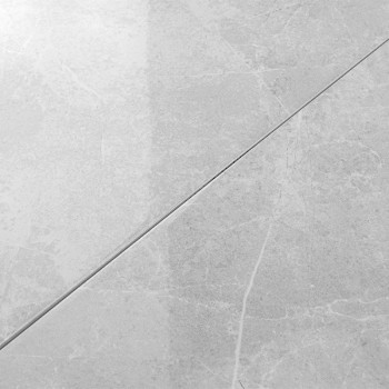 azulejos de mármol gris, costura diagonal que se cruza, acabado mate. Los patrones de venas sutiles añaden textura. Los azulejos