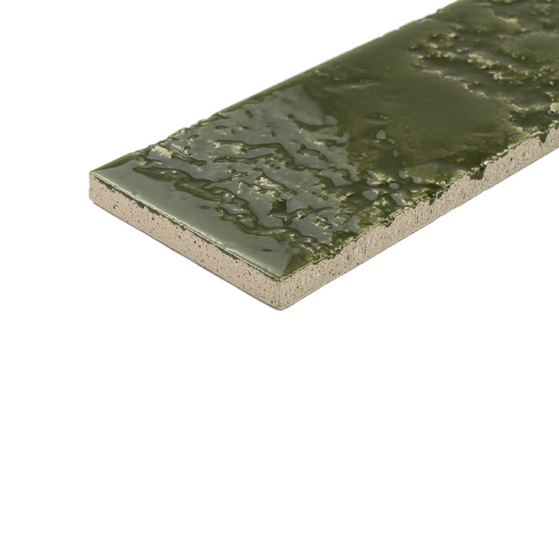 Long rectangular tile with unglazed beige border and bright green glazed surface with irregular texture; isolated on white background, showing edge and thickness.