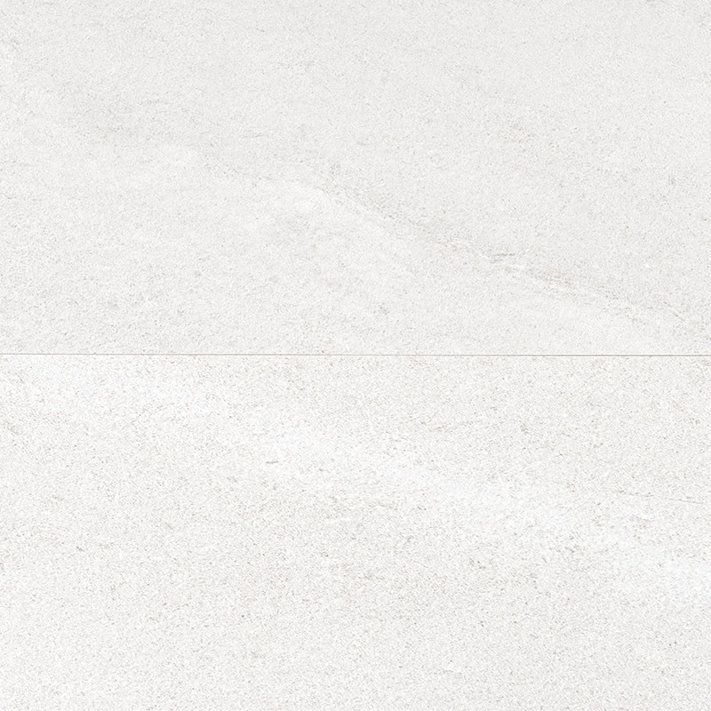 Creamy white ceramic tile, veined and matte; thin horizontal joint divides two equal pieces on a continuous and textured surface.