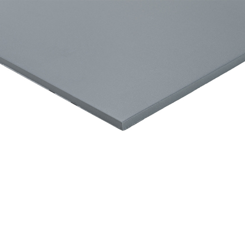 Square tile, smooth, bluish-gray in color, with a matte texture and straight edges, on a neutral white background with soft lighting that highlights a uniform tone.