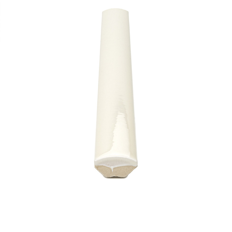 White glazed ceramic trim (rounded profile tile) seen from the front, cut end showing clay core, on isolated white background.