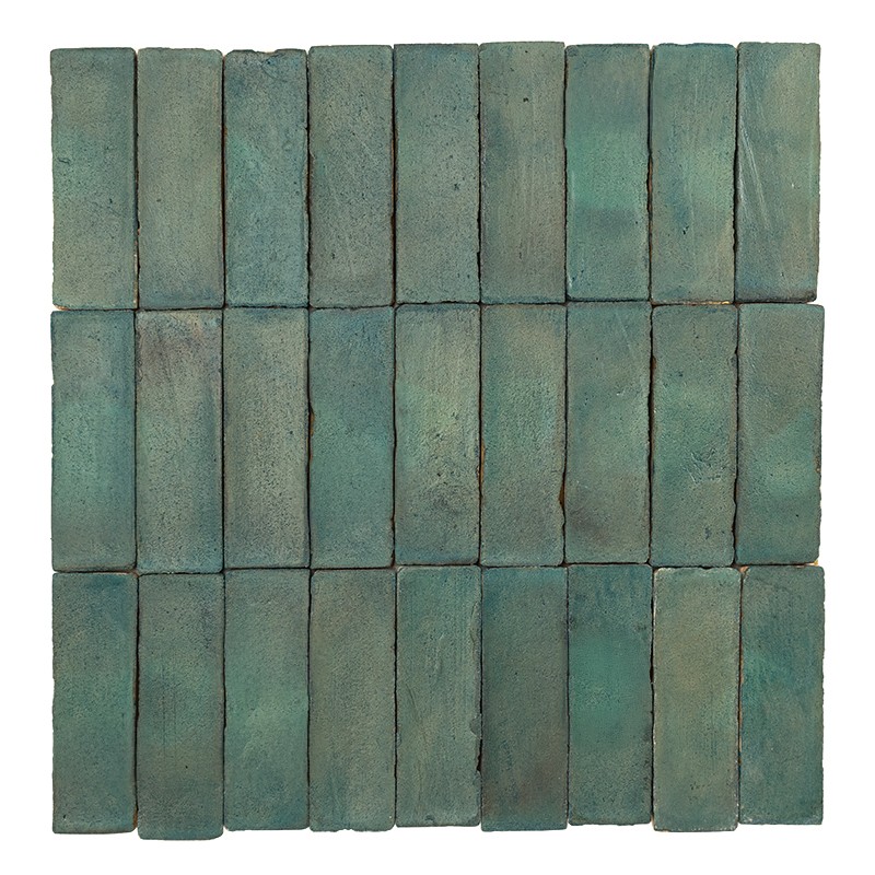 Rectangular tiles glazed in bluish-green, with a matte and worn texture; arranged in a rectangular matrix of rows and columns, with dark joints visible on a white background.